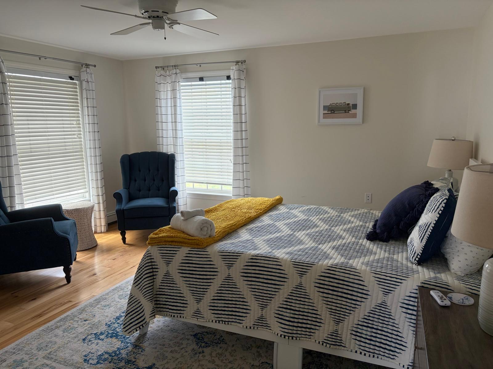 Freshly prepared bedroom with folded towels