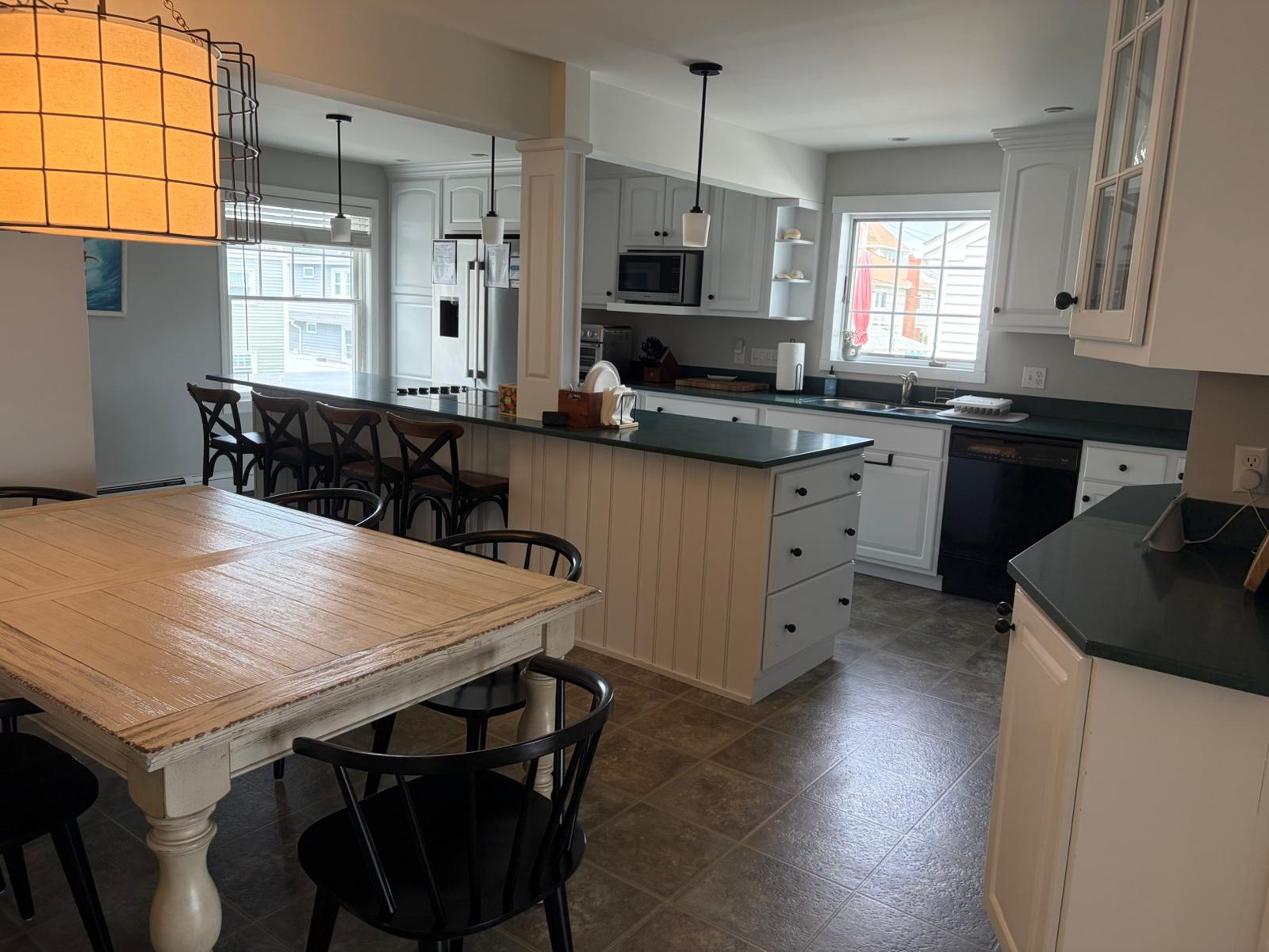 Clean white kitchen and dining area