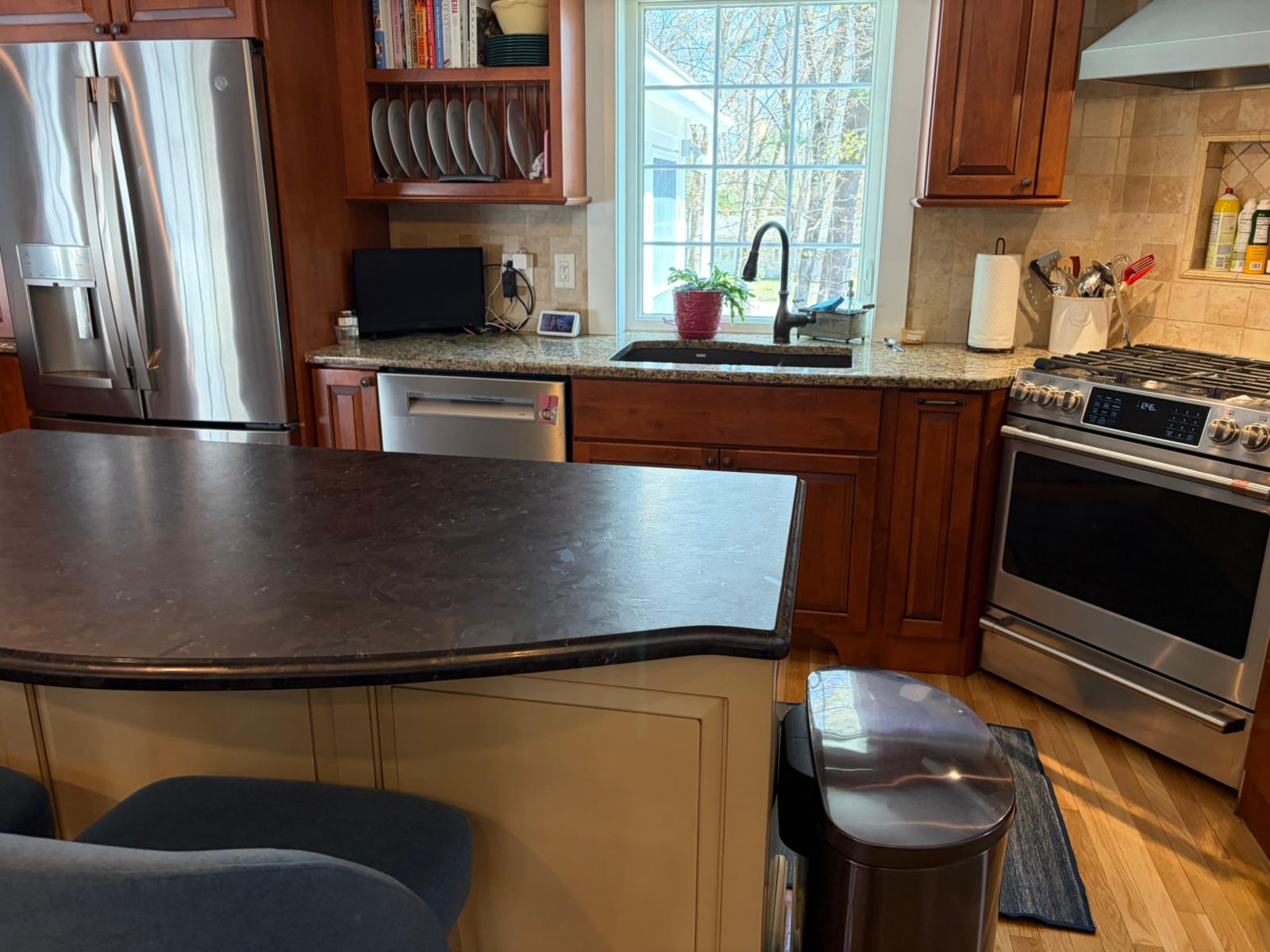Clean wood kitchen with polished island