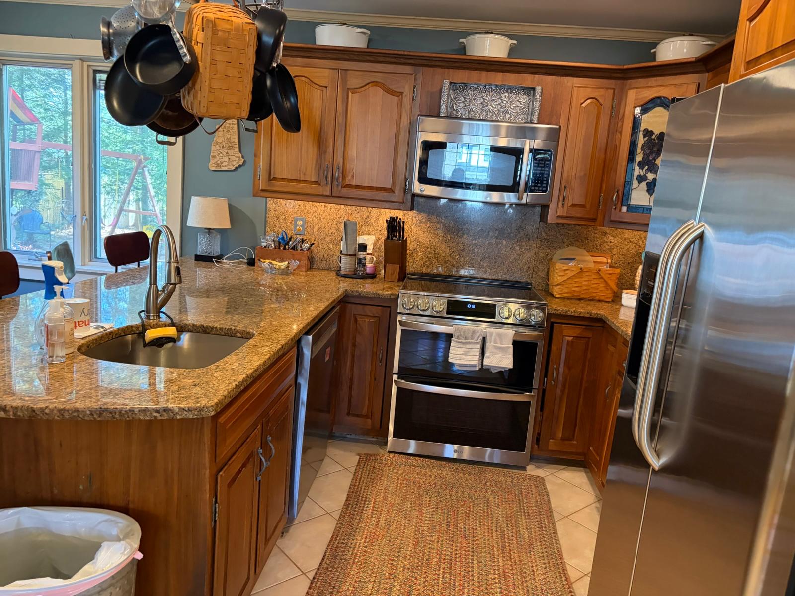 Detailed kitchen cleaning around counters and appliances