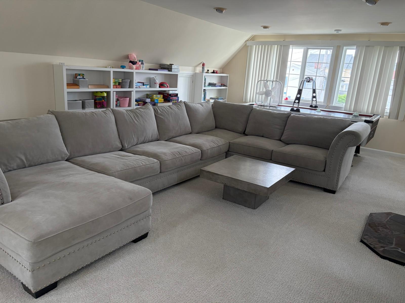 Spacious living room with a freshly cleaned sectional